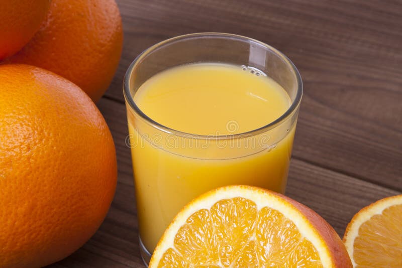 Oranges and orange juice stock image. Image of refreshing 49512339