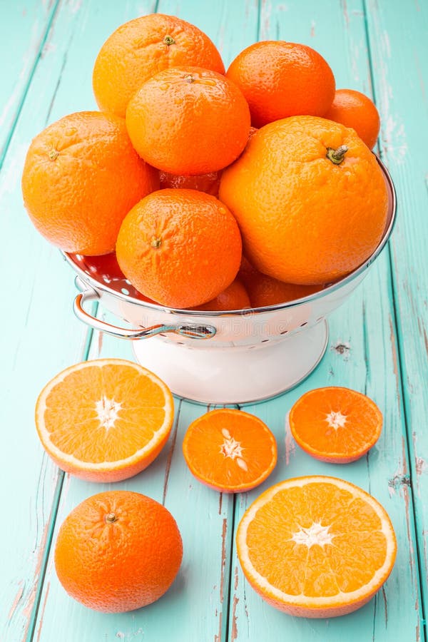 Oranges and Tangerines in retro colander.