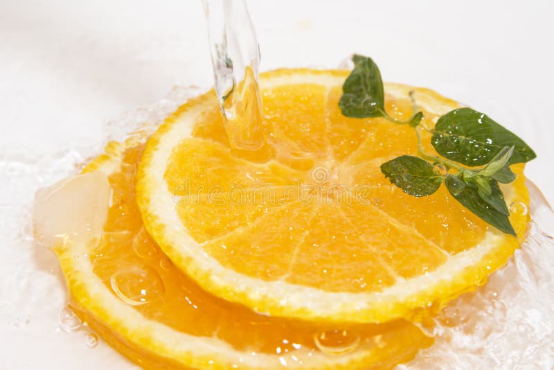 Juicy oranges slice with ice and mint. Juicy oranges slice with ice and mint