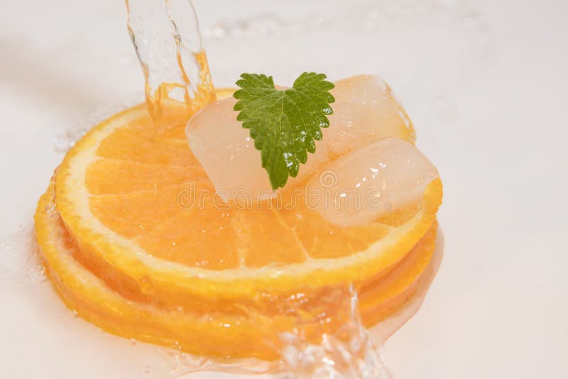 Juicy oranges slice with ice and mint. Juicy oranges slice with ice and mint