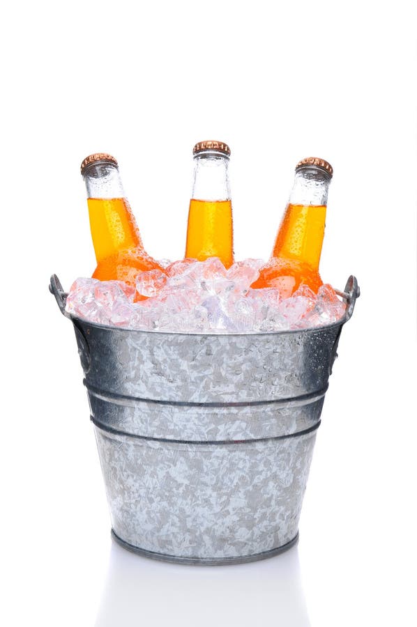 Orange Soda Bottles in a Bucket Filled with ice. Vertical Format over a white background with reflection. Orange Soda Bottles in a Bucket Filled with ice. Vertical Format over a white background with reflection.