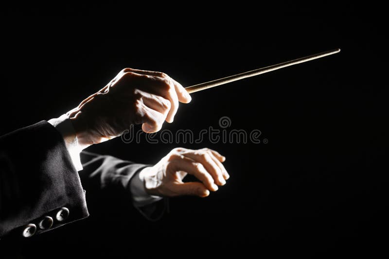 orchestra conductor hands baton music director holding stick