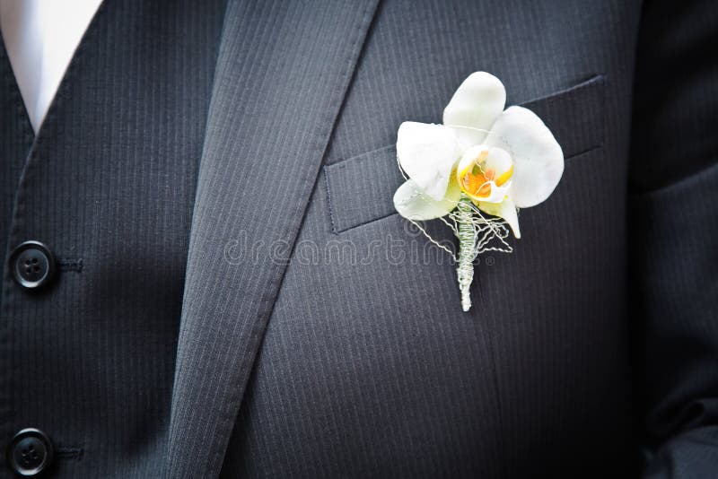 Orchid on the groom suit. Orchid on the groom suit