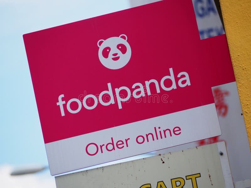 A Foodpanda `Order online` signboard on the side of a building in Malaysia. A Foodpanda `Order online` signboard on the side of a building in Malaysia