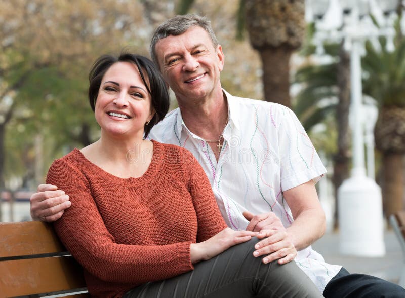 A Story About An Ordinary Couple Ordinary Mature Couple in Love Posing Outdoors Stock Photo - Image of