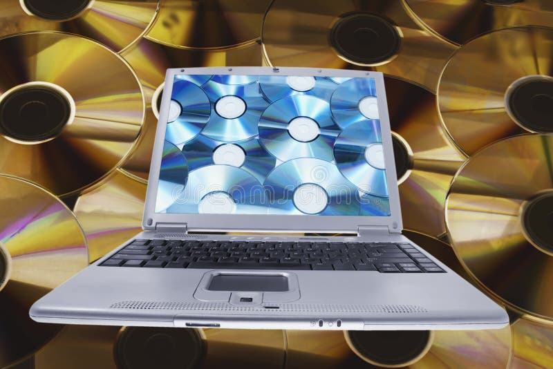 Ordinateur portable et disques compacts images libres de droits Ordinateur portable et disques compacts images libres de droits