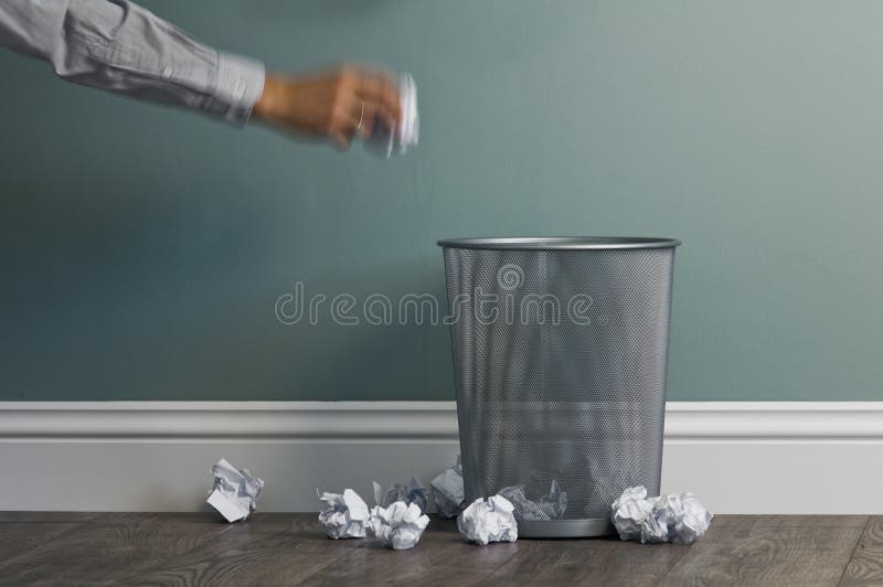 Office garbage near metal basket. Office garbage near metal basket