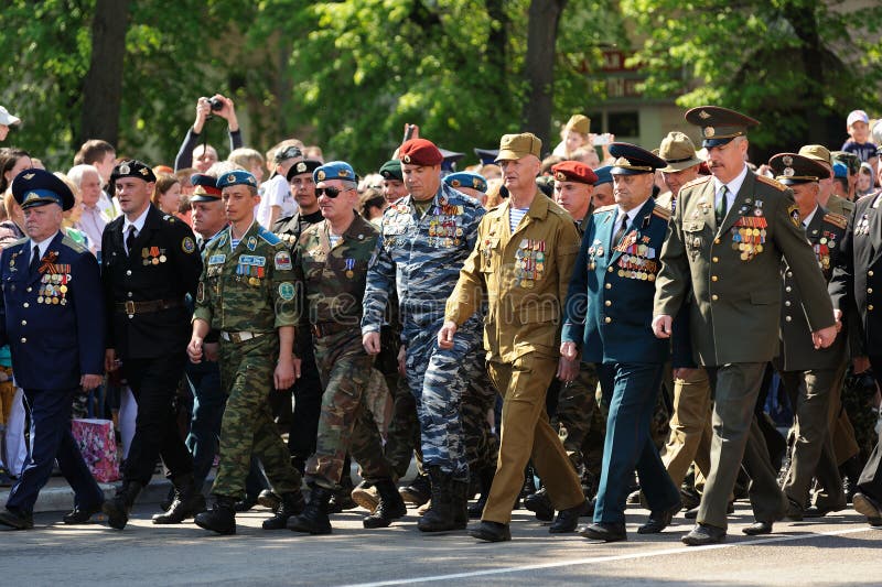 Orel, Russia - May 9, 2016: Celebration of 71th anniversary of the Victory Day (WWII). Russian Afganistan war veterans marching in parade horizontal. Orel, Russia - May 9, 2016: Celebration of 71th anniversary of the Victory Day (WWII). Russian Afganistan war veterans marching in parade horizontal