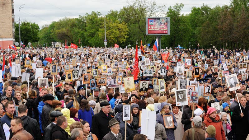 Orel, Russia - May 9, 2017: Victory Day selebration. Large crowd of people holding portraits of hero ancestors in Immortal Regiment march horizontal. Orel, Russia - May 9, 2017: Victory Day selebration. Large crowd of people holding portraits of hero ancestors in Immortal Regiment march horizontal