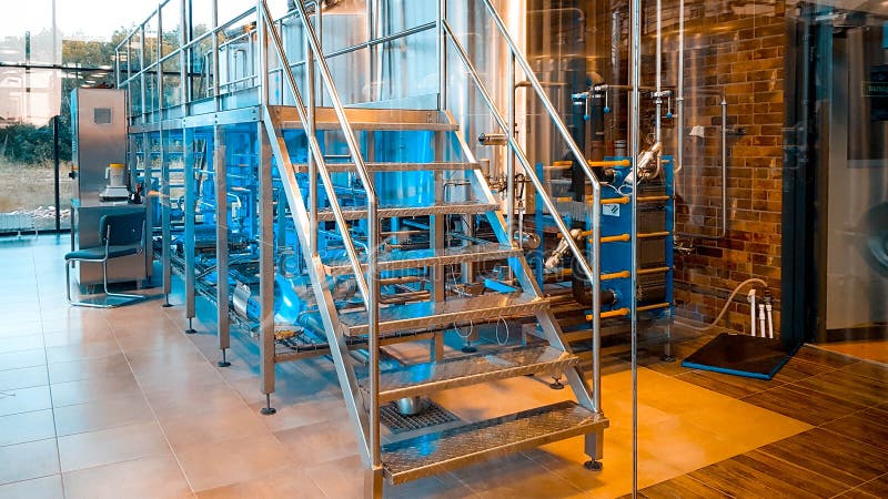 ORENBURG, RUSSIA - JULY 1, 2019: Interior of modern private brewery, beer factory. Steel stainless tanks for beer fermentation and maturation. ORENBURG, RUSSIA - JULY 1, 2019: Interior of modern private brewery, beer factory. Steel stainless tanks for beer fermentation and maturation