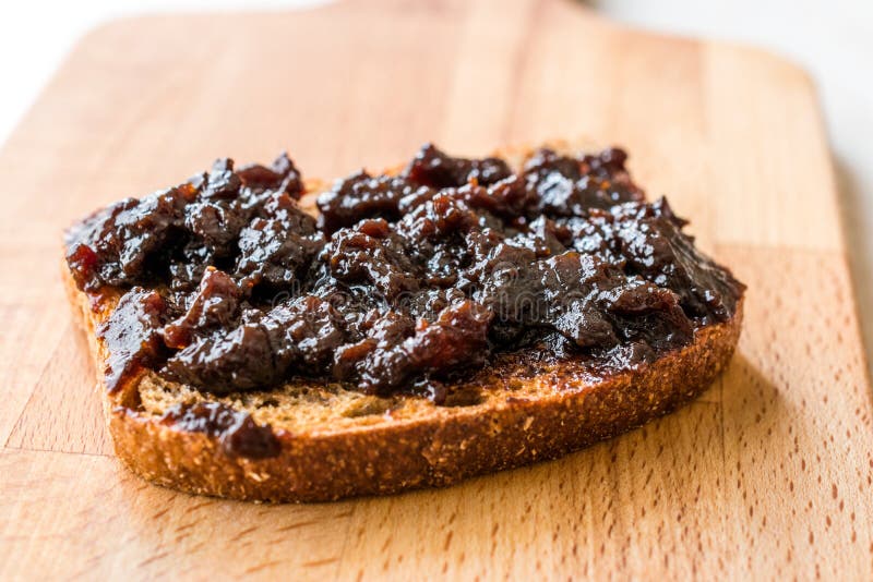 Organic Apple Molasses / Raw Fruit Paste Jam with Bread Stock Photo