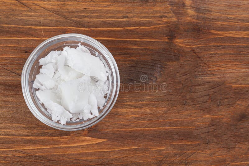 Organic Coconut Oil In Bowl On Wooden Table Top View Healthy