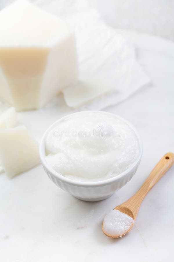 Organic coconut oil for cooking and baking on kitchen table stock photography