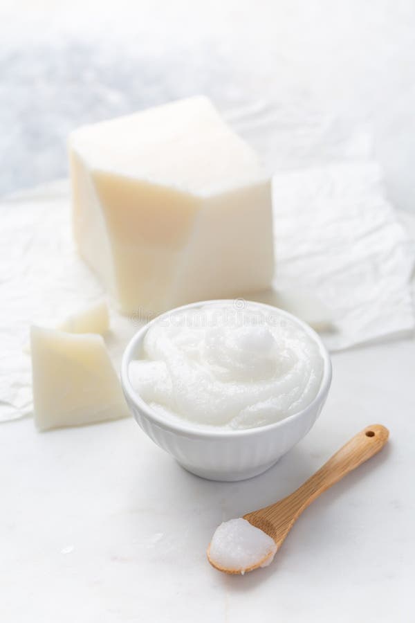 Organic coconut oil for cooking and baking on kitchen table royalty free stock images