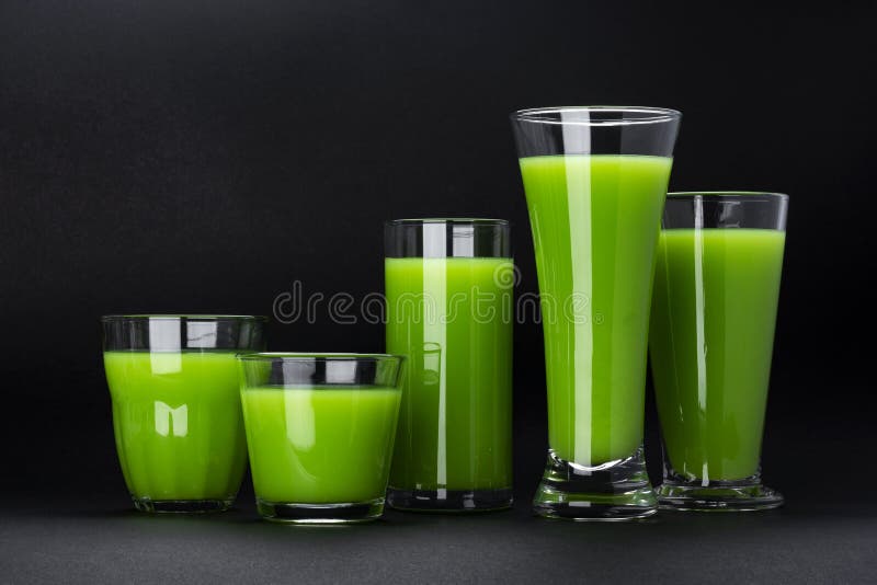 Organic green smoothie, apple juice on isolated on black background with copy space, fresh celery cocktail