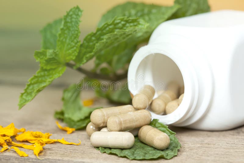 Organic Herb capsule stock image. Image of medication 50930149