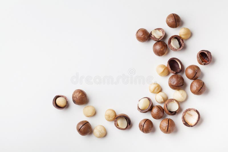 Organic macadamia nuts on white table top view. stock photography Organic macadamia nuts on white table top view. stock photography