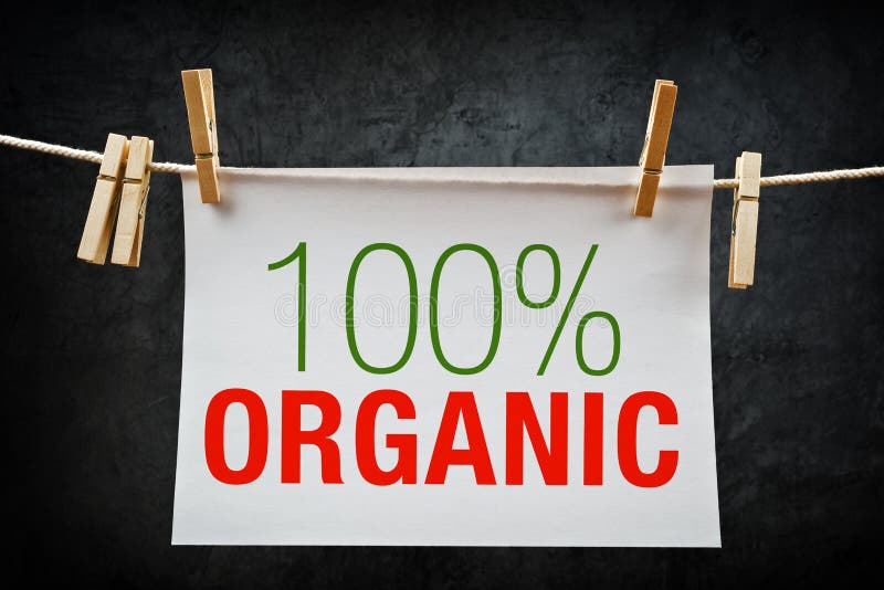 100% Organic. Hundred percent organic label hanging on rope. 100% Organic. Hundred percent organic label hanging on rope.