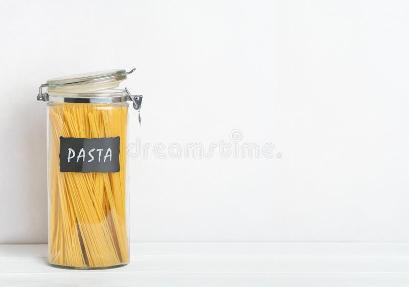 Organization of Storage in the Kitchen. Pasta in Glass Container on a