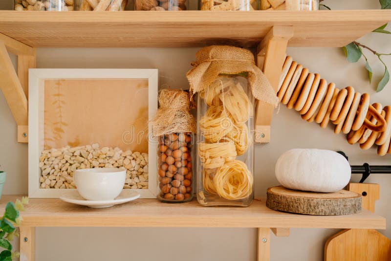 Organization of Storage on Shelves in the Kitchen is Made of Wood