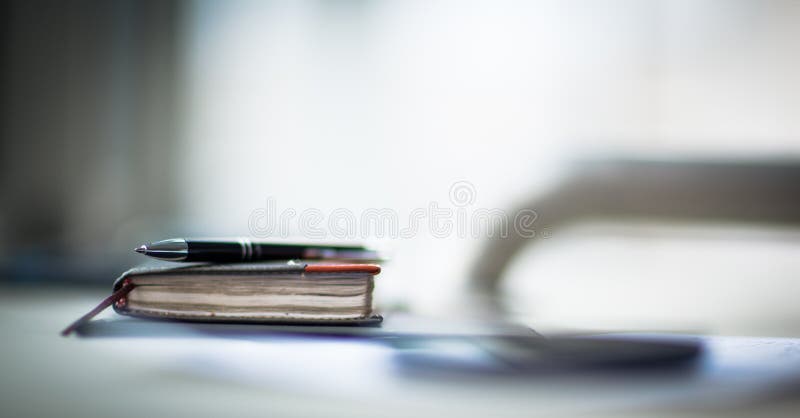 Organizer and pen on office desk