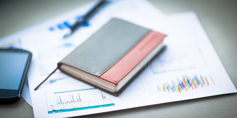 Organizer and pen on office desk