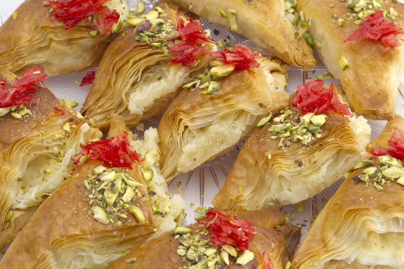 Oriental Arabic sweet warbat with qishta, kadayif, kunafa, with pistachio a...