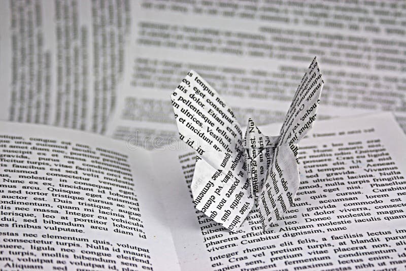 Origami butterflies with words coming out of a book. Istagram style filter applied. Lorem Ipsum text used. Origami butterflies with words coming out of a book. Istagram style filter applied. Lorem Ipsum text used.
