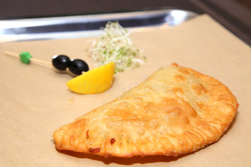 Original Serving of Meat Pie in a Restaurant. Argentinian Empanada