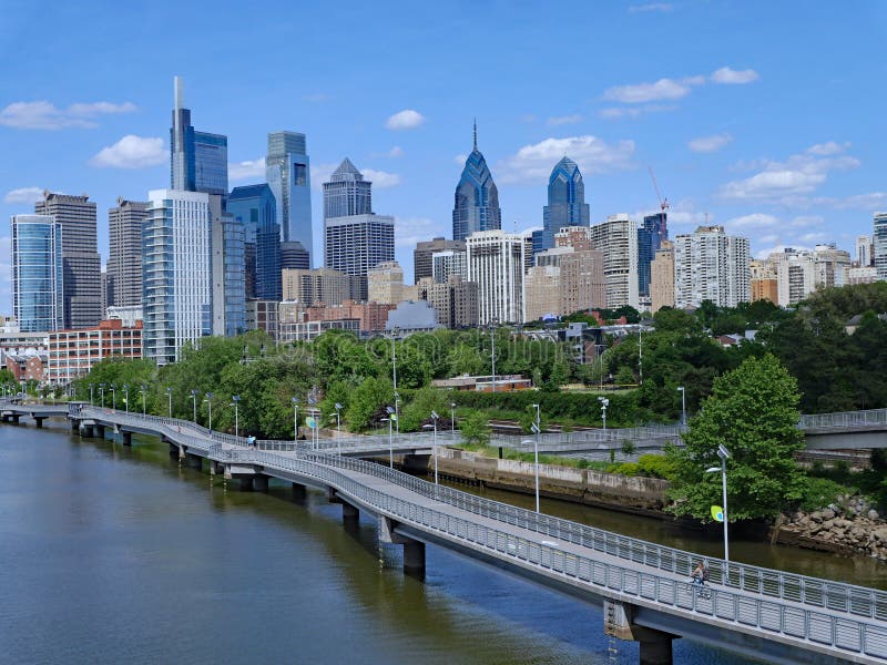 Philadelphia skyline in 2019 with recreational boardwalk along the Schuylkill River, known as the Schuylkill Banks. Philadelphia skyline in 2019 with recreational boardwalk along the Schuylkill River, known as the Schuylkill Banks