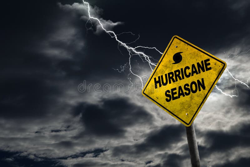 Hurricane season with symbol sign against a stormy background and copy space. Dirty and angled sign adds to the drama. Hurricane season with symbol sign against a stormy background and copy space. Dirty and angled sign adds to the drama.