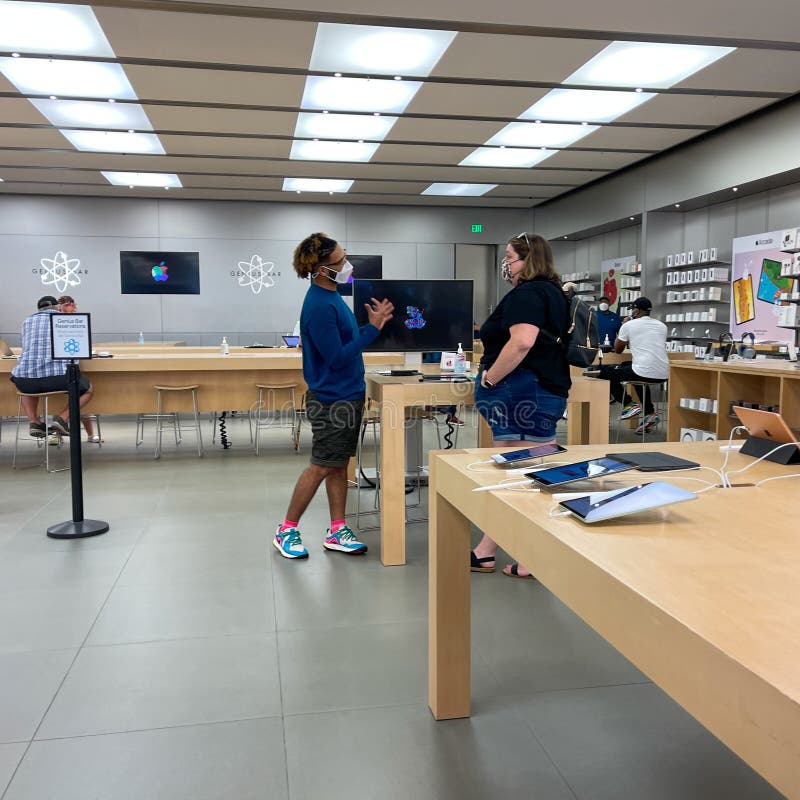 A Customer at an Apple Store Looking at His IPhone while Waiting at an Apple  Store Editorial Photo - Image of imac, computer: 237668441