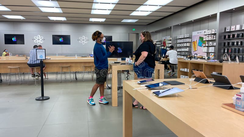 A Customer at an Apple Store Being Helped by an Apple Employee at an Apple  Store Editorial Stock Photo - Image of macbook, ipad: 235899068