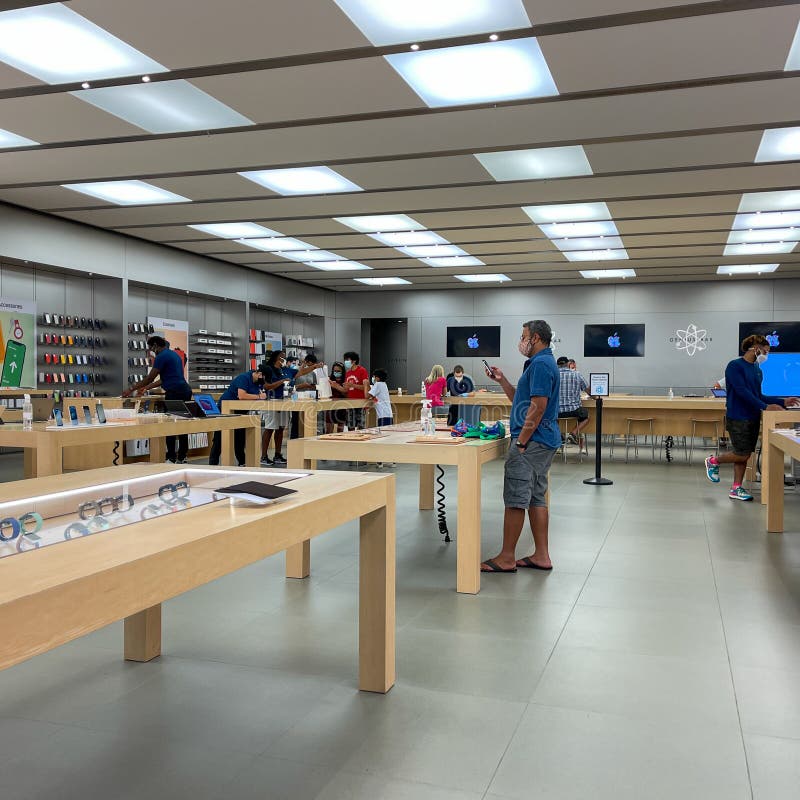 A Customer at an Apple Store Looking at His IPhone while Waiting at an Apple  Store Editorial Photo - Image of imac, computer: 237668441