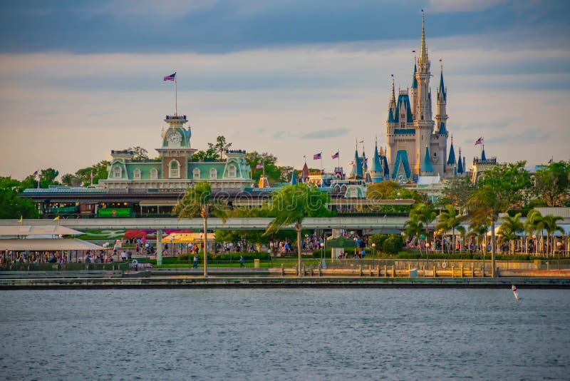 Panoramic view of Cinderella`s Castle and vintage Train Station at Magic Kingdom in Walt Disney World