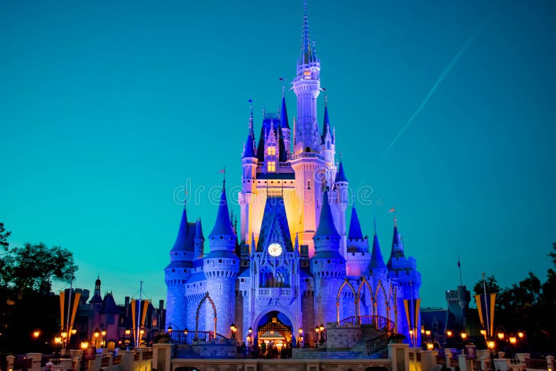 Panoramic view of illuminated Cinderella`s Castle on blue night background in Magic Kingdom at Walt Disney World 1