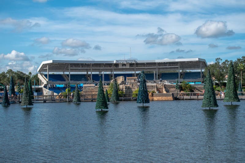 Christmas trees and panoramic view of Bayside Stadium on blue lake at Seaworld stock photos Christmas trees and panoramic view of Bayside Stadium on blue lake at Seaworld stock photos