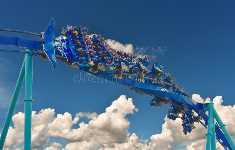 Group of people enjoy a fast Manta Roller coaster at Seaworld Orlando. royalty free stock image Group of people enjoy a fast Manta Roller coaster at Seaworld Orlando. royalty free stock image