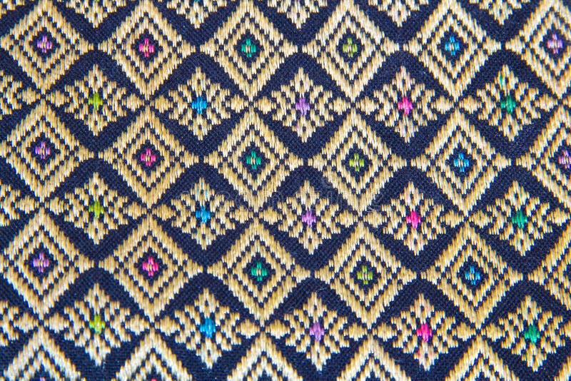 The ornament pattern on the wall Thai. window Lai Thai pattern. Bags of Souvenirs from Thailand. Design ethnic texture. Village ca stock image The ornament pattern on the wall Thai. window Lai Thai pattern. Bags of Souvenirs from Thailand. Design ethnic texture. Village ca stock image