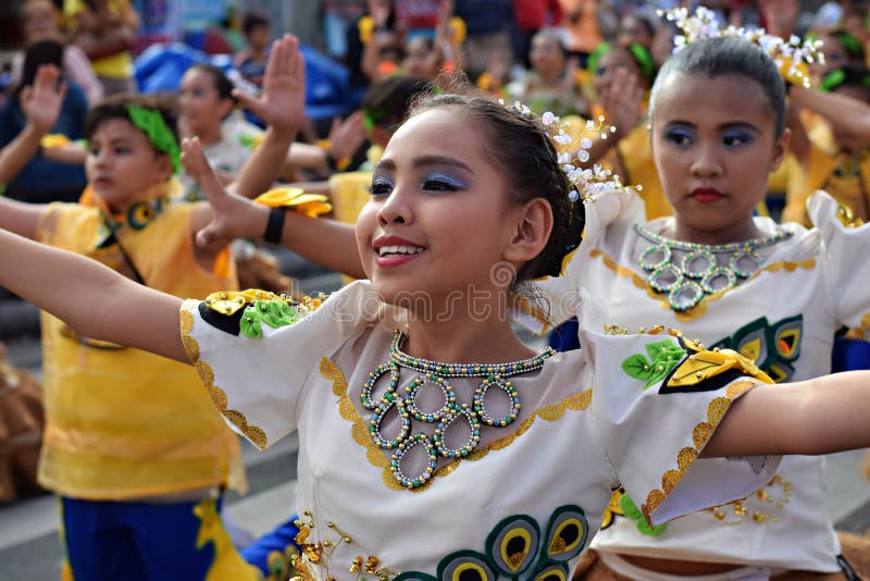 Ornate coconut costume worn by girls as they gracefully dance on street