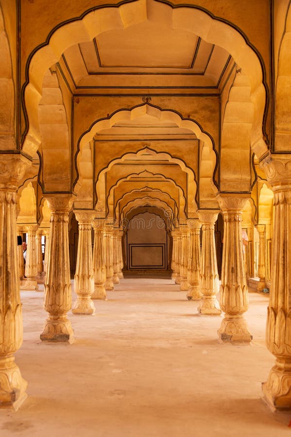 Ornate columns in the Diwan-e-aam building, Amber Fort, Amer , Rajasthan, India .A narrow 4WD road leads up to the entrance gate, known as the Suraj Pol (Sun Gate) of the fort. It is now considered much more ethical for tourists to take jeep rides up to the fort, instead of riding the elephants. Amer Fort or Amber Fort is a fort located in Amer, Rajasthan, India. Amer is a town with an area of 4 square kilometres (1.5 sq mi) located 11 kilometres (6.8 mi) from Jaipur, the capital of Rajasthan. Located high on a hill, it is the principal tourist attraction in Jaipur. Amer Fort is known for its artistic style elements. With its large ramparts and series of gates and cobbled paths, the fort overlooks Maota Lake which is the main source of water for the Amer Palace. Ornate columns in the Diwan-e-aam building, Amber Fort, Amer , Rajasthan, India .A narrow 4WD road leads up to the entrance gate, known as the Suraj Pol (Sun Gate) of the fort. It is now considered much more ethical for tourists to take jeep rides up to the fort, instead of riding the elephants. Amer Fort or Amber Fort is a fort located in Amer, Rajasthan, India. Amer is a town with an area of 4 square kilometres (1.5 sq mi) located 11 kilometres (6.8 mi) from Jaipur, the capital of Rajasthan. Located high on a hill, it is the principal tourist attraction in Jaipur. Amer Fort is known for its artistic style elements. With its large ramparts and series of gates and cobbled paths, the fort overlooks Maota Lake which is the main source of water for the Amer Palace.