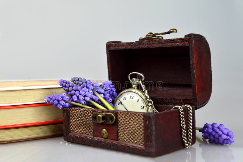 Old pocket watch, flowers, books and treasure chest. Old pocket watch, flowers, books and treasure chest