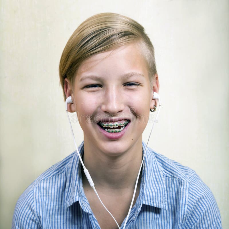 Teen with braces on his teeth. Orthodontics and bite correction. Teen with braces on his teeth. Orthodontics and bite correction.