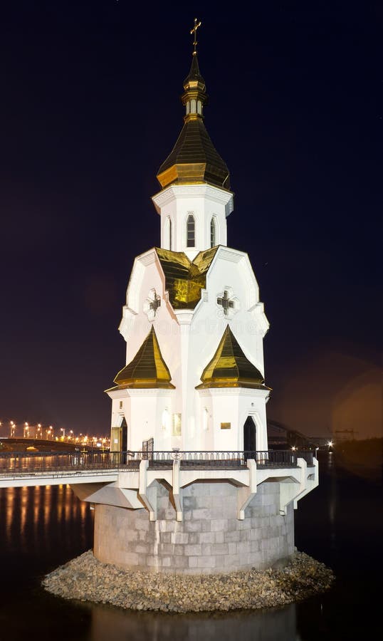 The orthodox church on the water at night