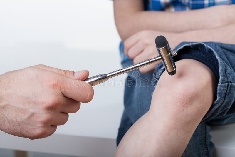 Orthopedist during examining a boy royalty free stock photo