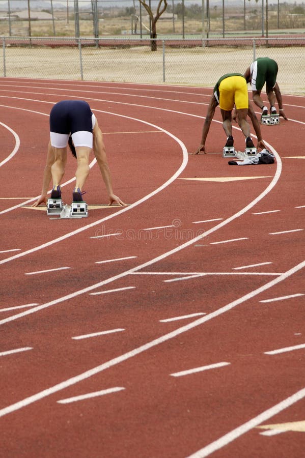 Start of the men's 400 meter run during a college track meet. Start of the men's 400 meter run during a college track meet.