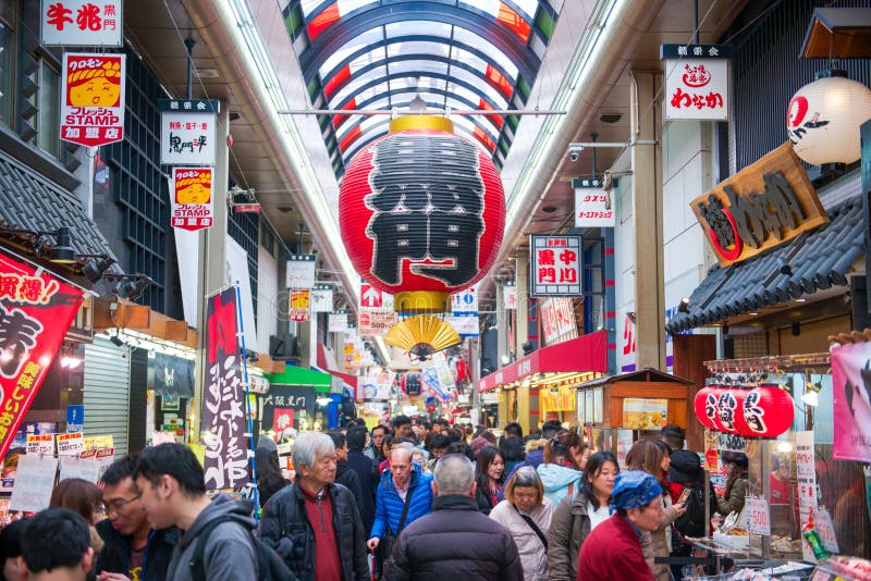 Osaka, Japan - November 19, 2017 :Many tourist at Kuromon Ichiba fish market. The Kuromon Ichiba Market is a large market and mos stock image Osaka, Japan - November 19, 2017 :Many tourist at Kuromon Ichiba fish market. The Kuromon Ichiba Market is a large market and mos stock image
