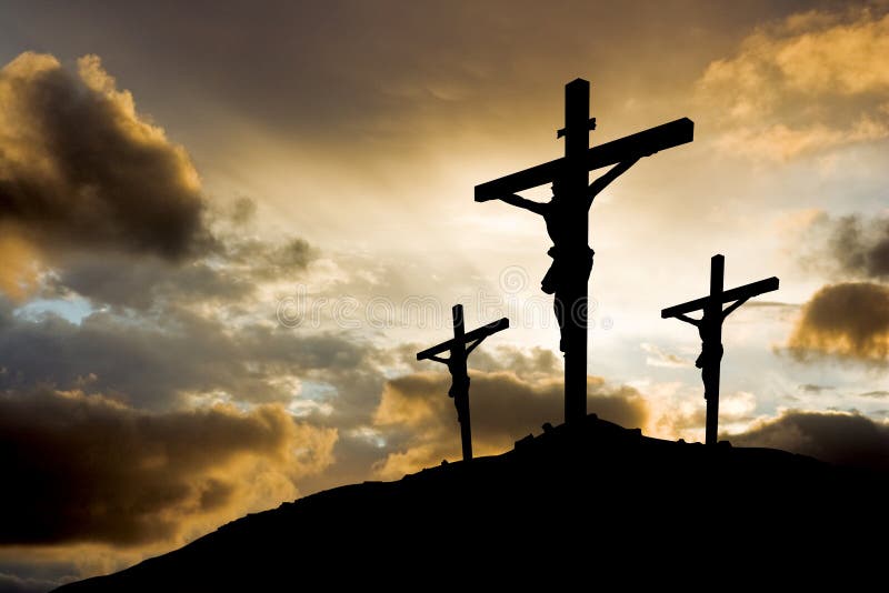 Three crosses silhouetted against setting sun. Three crosses silhouetted against setting sun