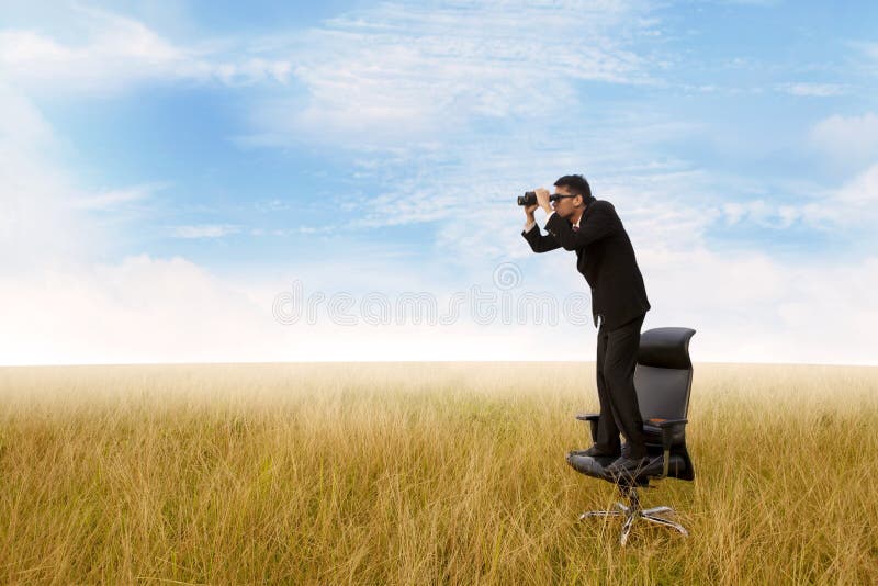 Business man with binoculars looking to the future. Business man with binoculars looking to the future