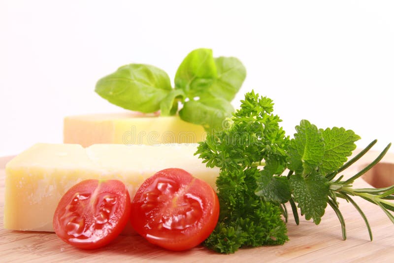 Cheese with tomatoes and basil in detail. Cheese with tomatoes and basil in detail